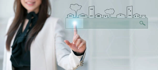 woman pointing finger on house drawing with light on hand -real estate promotion